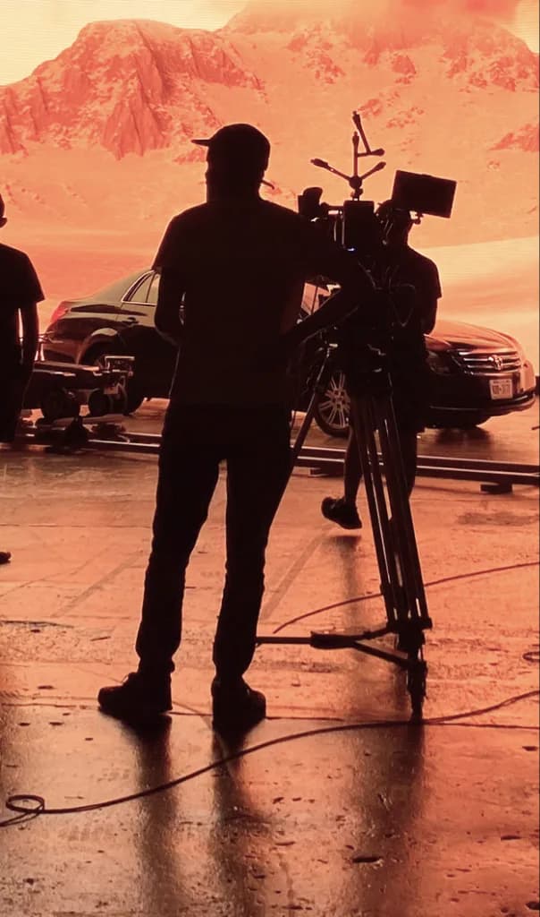 Camera crew filming in front of the main LED wall